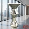 Silver diamond cut cocktail table at modern hotel event space city skyline floor-to-ceiling windows