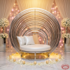Silver round birdcage sofa side view wedding photo zone warm golden halo light arch bars