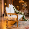 White gold heart loveseat side view wedding hall gold carved frame legs warm ambient