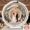 Silver concentric circle moon gate at luxury wedding ceremony couple floral garlands crystal chandeliers