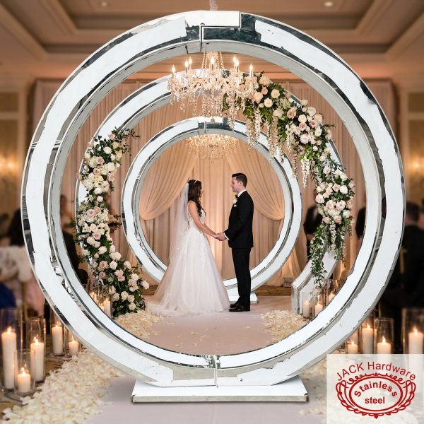 Silver concentric circle moon gate at luxury wedding ceremony couple floral garlands crystal chandeliers