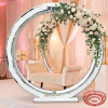 Silver multi-ring moon gate at hotel ballroom photo booth white blush florals fairy light bokeh