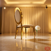 Gold round disc-back chair side view luxury event circle backrest halo light marble