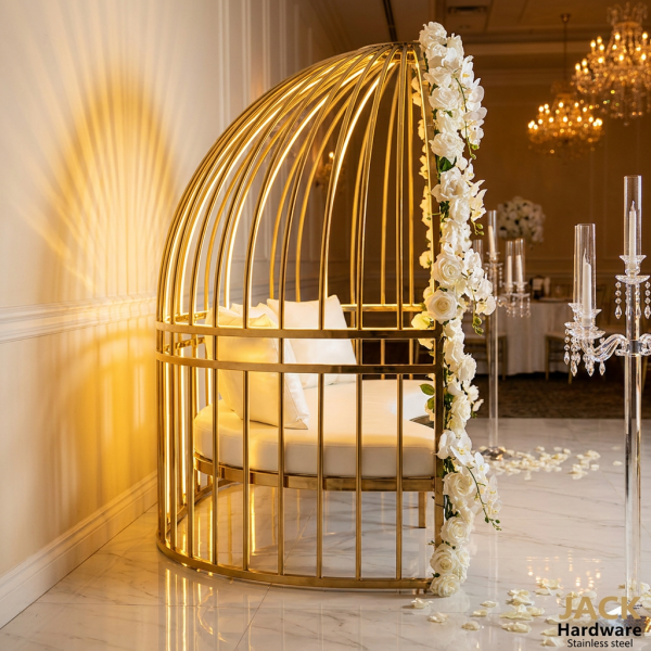 Gold birdcage loveseat side view wedding reception warm uplighting arch golden shadow marble