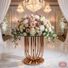 Rose gold cage pedestal with blush white floral dome chandeliers curved slats glow