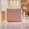 Powder pink box armchair side view modern luxury clean pink silhouette warm ambient light