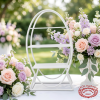 Egg-shaped display rack at bright outdoor garden wedding pastel floral decor