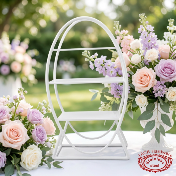 Egg-shaped display rack at bright outdoor garden wedding pastel floral decor