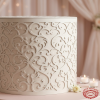 White baroque carved cylinder side view close-up wedding venue candlelight shadow pattern