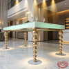 Gold ball-bead column legs dining table side view hotel restaurant spherical shadows marble floor