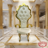 Royal throne chair on marble pedestal at grand hotel lobby showcase spotlights