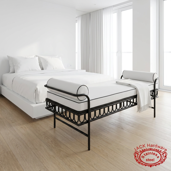 Black iron white velvet bench at upscale hotel minimalist white bedroom natural daylight scrollwork visible