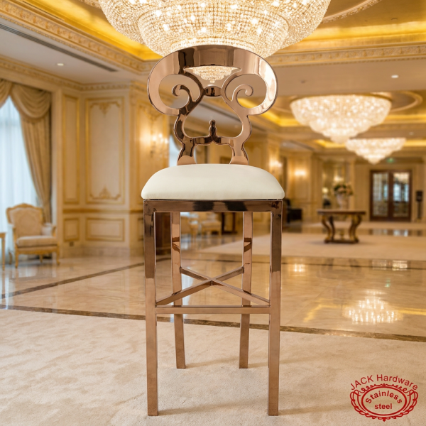Rose gold scrollwork bar stool at grand luxury hotel ballroom crystal chandeliers ivory gold decor