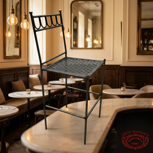 Vintage iron scrollwork bar stool at upscale hotel bistro French brasserie Edison pendants