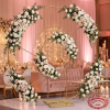 Gold radial circle arch as hotel wedding photo backdrop white blush roses fairy light bokeh