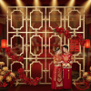 Gold Chinese lattice wall at luxury Chinese-themed wedding ceremony stage red peony garlands gold lanterns