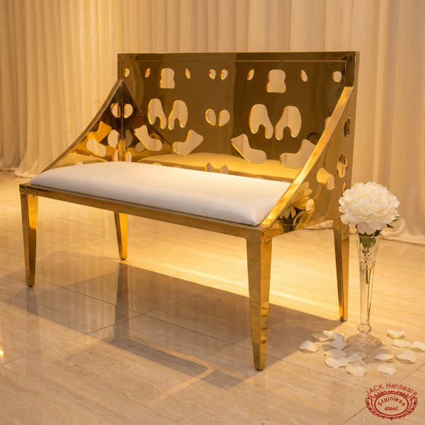 Gold perforated double bench side view luxury event space wide silhouette warm light