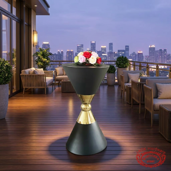 Dark hourglass cocktail stand at hotel rooftop terrace evening city skyline purple dusk