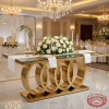 Gold 4-ring chain-link base dining table at luxury hotel banquet hall formal dinner chandeliers