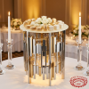 Silver gold alternating tube cylinder stand at hotel wedding event 45 degree warm spotlights