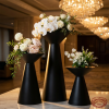 Black hourglass double-cone stands hotel wedding 45 degree chiaroscuro contrast waist detail