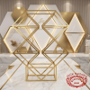 Diamond geometric display rack at creative modern wedding venue geometric decor