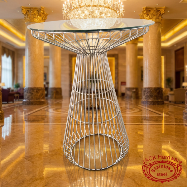 Rose gold cage cocktail table at luxury 5-star hotel grand lobby marble chandelier warm gold