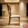 Gold butterfly wing dining chair side view luxury event dramatic wing silhouette warm light