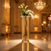 Gold round flower pedestal side view grand ballroom warm uplighting full reflection marble