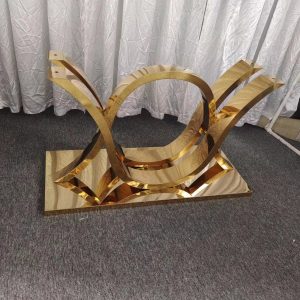 WENDING gold wing-and-ring sculptural base marble dining table art object hotel table