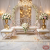 White twig branch bench ottomans at romantic wedding bridal waiting area white florals chandeliers