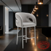 Grey barrel bar stool at contemporary luxury hotel bar sleek dark interior pendant lighting