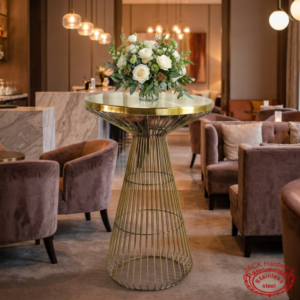 Gold round cage bar table at upscale hotel cocktail lounge white roses floral arrangement