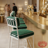 White green velvet bar stools at upscale hotel champagne lounge multiple stools florals