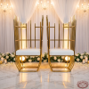 Gold tube throne chair pair side view wedding ceremony warm golden uplighting uplight glow