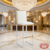 White gold frame bar stool at luxury 5-star hotel lobby bar marble floors crystal chandeliers