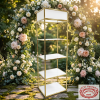 Gold white display shelf at romantic outdoor garden wedding floral arch golden hour bokeh