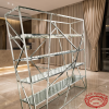 Wide format glass shelf at modern hotel lobby marble floors champagne drapes