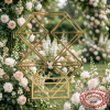 Geometric multi-cell rack at outdoor garden wedding lush floral backdrop bokeh