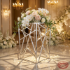 Silver diagonal crosshatch mesh pedestal hotel wedding setup 45 degree geometric pattern spotlights