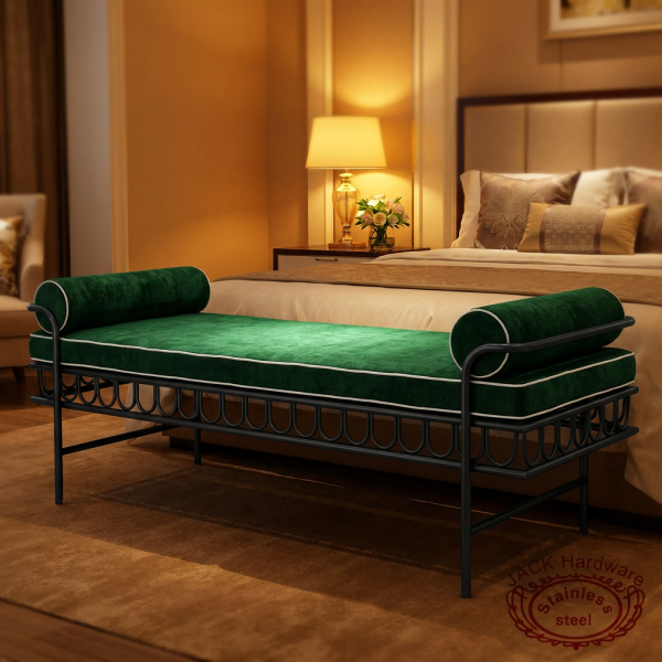 Black iron green velvet bench at upscale hotel room 45 degree bedside lamp ornate scrollwork