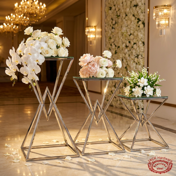 Silver triangle X-cross frame stands hotel wedding setup 45 degree shadow pattern spotlights