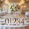 Mirror silver number standees as table markers at luxury hotel wedding banquet fine china chandeliers