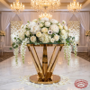 Gold inverted crown V-blade pedestal with white peonies roses dome V-legs visible chandeliers
