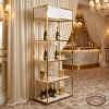 Gold frame white shelf at upscale hotel champagne bar ivory gold decor candlelit luxury