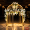 Gold birdcage dome pavilion side view wedding venue warm uplighting full silhouette marble