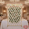 Gold diamond mesh screen with white blush roses woven through grid hotel wedding chandeliers