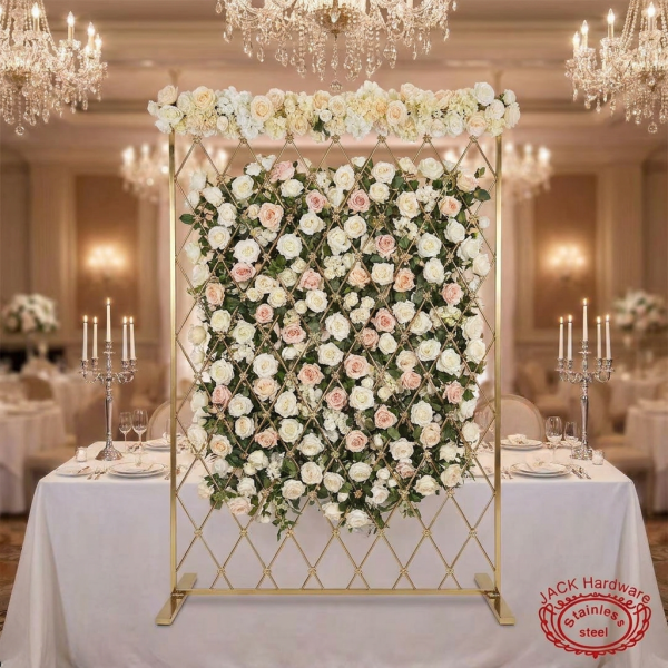Gold diamond mesh screen with white blush roses woven through grid hotel wedding chandeliers