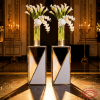 Silver tapered square bases side view wedding venue warm uplighting trapezoidal shadow marble