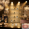 Gold 6-tier luxury champagne shelf at premium bar crystal decor warm golden spotlight